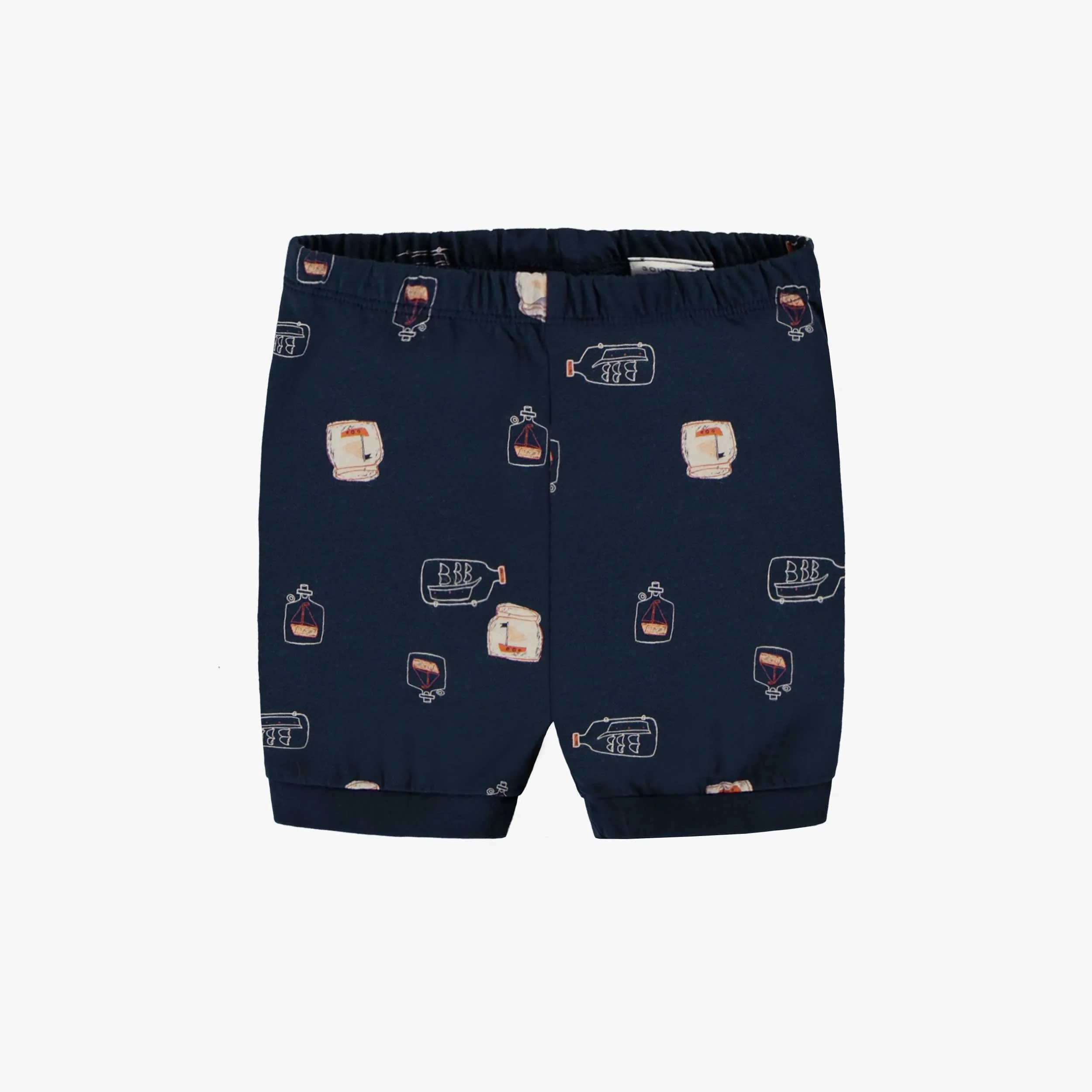 Pyjama deux pièces marine avec motif de bateaux dans une bouteille en doux coton, enfant.  || Two-piece navy pajamas with ship-in-a-bottle motif in soft cotton, child.