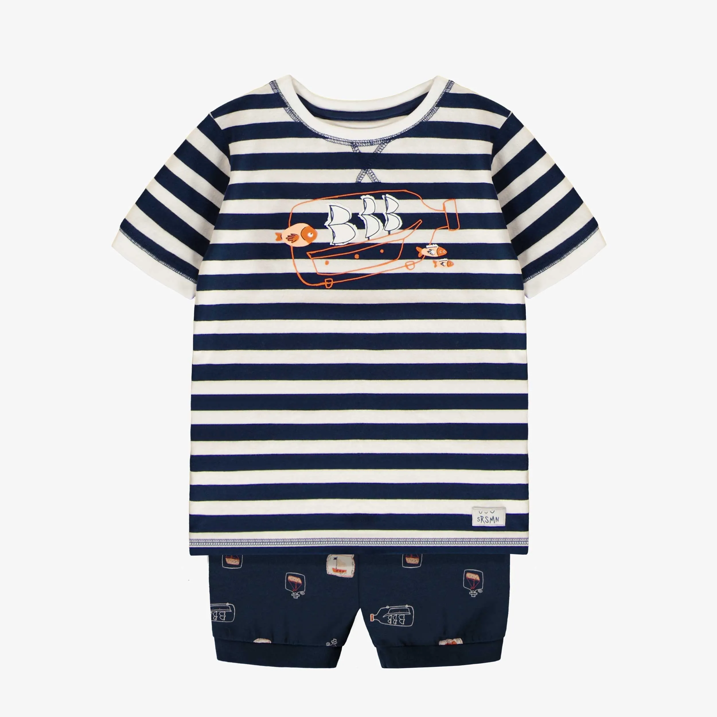 Pyjama deux pièces marine avec motif de bateaux dans une bouteille en doux coton, enfant.  || Two-piece navy pajamas with ship-in-a-bottle motif in soft cotton, child.